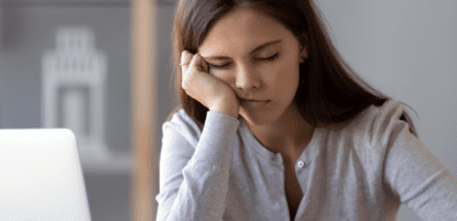 Woman sleeping at desk